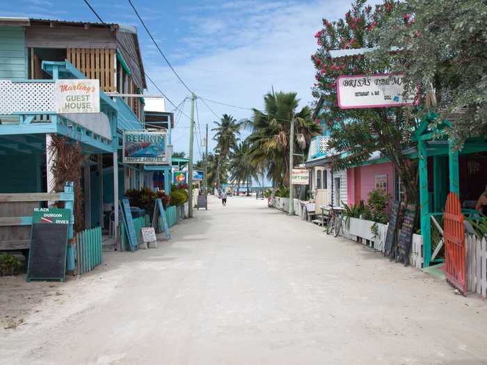 Belize’s Caye Caulker island in the Caribbean Sea is tiny but the perfect place for someone who loves island life. Sand streets, palm trees, colored homes, and thatched roofs can all be found in abundance here.