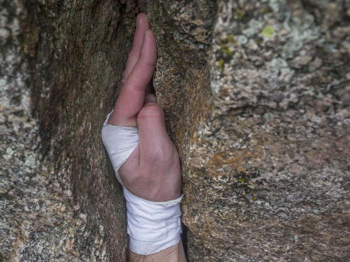 Honnold uses a technique called “jamming,” where he sticks his hands and feet right into the crack.