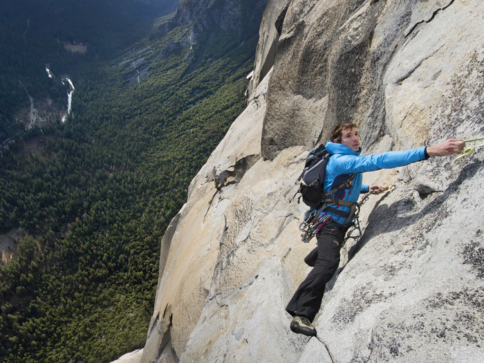 When it gets too difficult to “free solo,” Honnold grabs onto pieces of nylon left behind by other climbers. This is near the top, about 3,000 ft above ground.