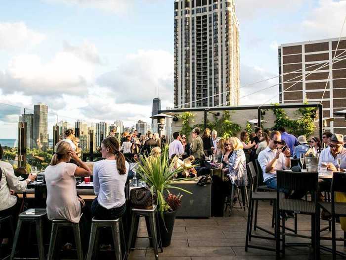 Drink outdoors on a rooftop.