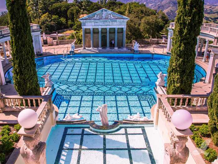 Go for a dip in a luxurious pool, like the Neptune Pool in the historic Hearst Castle in San Simeone, California, which is open to the public for a fee.