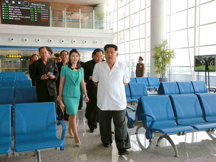 Kim Jong-Un returned to the terminal with his wife and a cadre of supporters after the building was completed.