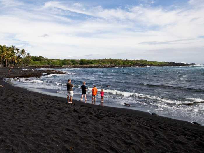 Punalu’u Beach, located between Pahala and Na?alehu, in Hawaii, is also known as the Black Sand Beach thanks to its stark black sand caused by basalt from volcanic activity.