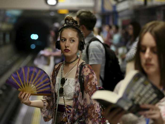 A young woman fanned herself while waiting for the tube on Britain