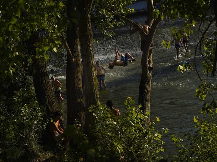 This group used vines to catapult themselves into the Arga River in northern Spain as temperatures reached 98 degrees Fahrenheit. Weather stations throughout Spain are warning residents to be aware of potential wildfires caused by the dry heat.