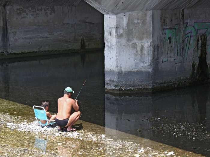 This father-and-son duo in Nice, France skipped the boat and went fishing from a perch on the shore.