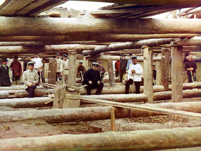 And this photograph, taken in 1912, of workers and supervisors preparing to pour cement foundations for a sluice dam across the Oka River, near the town of Denivo.