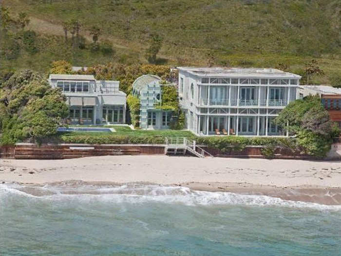 In 2012, Ellison bought the home belonging to former Yahoo CEO Terry Semel for $37 million. The three-quarter-acre lot has three structures:  a home, lavish guest house, and barrel-ceiling screening room.