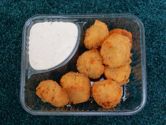 Cowboy Bites: Sweet corn kernels, bacon, jalapeños and cream cheese blended into bite-size balls, breaded and fried, and served with ranch dipping sauce.