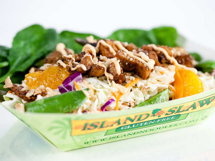 Island Slaw: Gluten-free island-style coleslaw with pineapple, mandarin oranges, sugar snap peas and spinach, all topped with teriyaki chicken, a light Sriracha glaze and macadamia nuts.