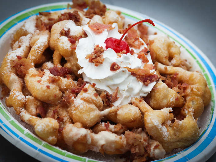 Maple Bacon Funnel Cake: A funnel cake infused with bacon pieces, then topped with sweet maple glaze and sprinkled with more bacon.