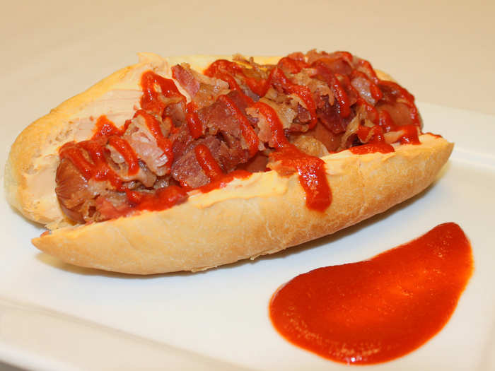 Sriracha Dog: All-beef hot dog on a Sriracha cream cheese-smeared bun, topped with bacon bits and drizzled with Sriracha sauce.