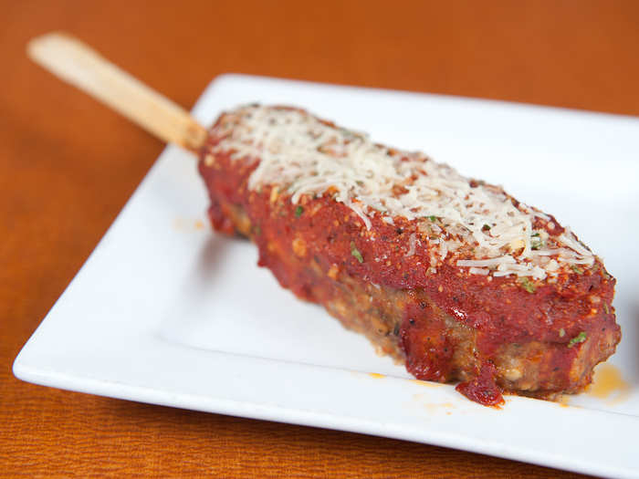 Stuffed Italian Meatloaf: On-a-Stick Italian meatloaf stuffed with Mozzarella and pepperoni, topped with marinara sauce and a Parmesan herb blend and served on-a-stick.