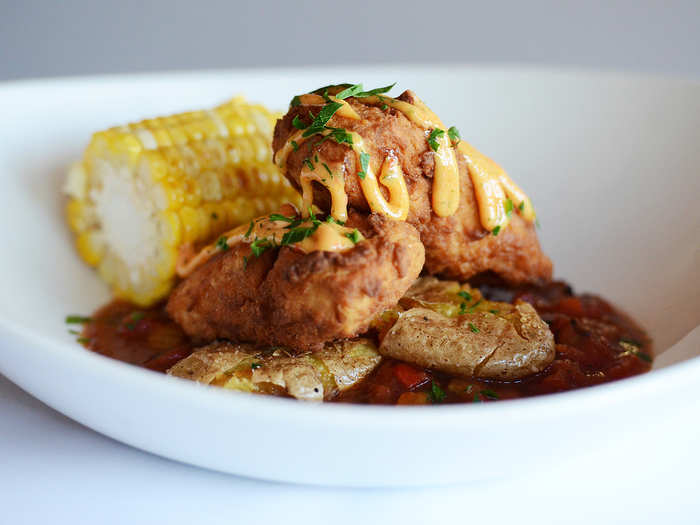 Up Nort Shoreman’s Lunch: Battered northern pike in a fresh tomato sauce with potatoes and corn, finished with smoked pepper tartar sauce.