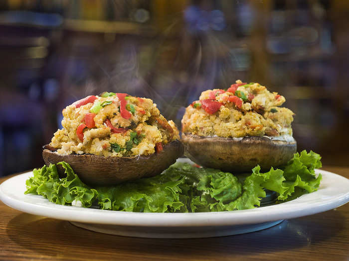 Walleye Stuffed Mushrooms: Jumbo mushroom caps stuffed with flavored cream cheese spread, walleye, three cheeses, red pepper, panko breadcrumbs and a special sauce.