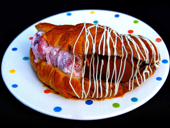 Doo Wop Dip: Strawberry ice cream with real strawberries in a croissant, dipped in chocolate and drizzled with white chocolate.