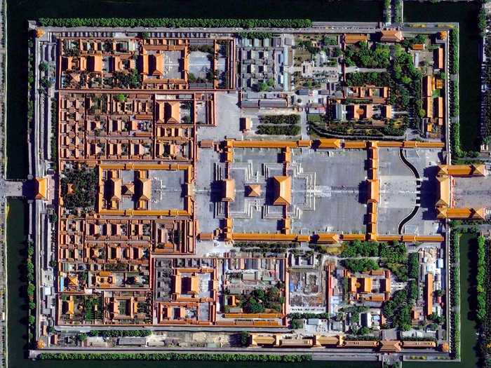 The Forbidden City in Beijing, China was built from 1406 until 1420 by more than one million workers. The palace complex, which contains 9,999 rooms, is surrounded by walls and a moat that are 26 feet high and 171 feet wide, respectively.