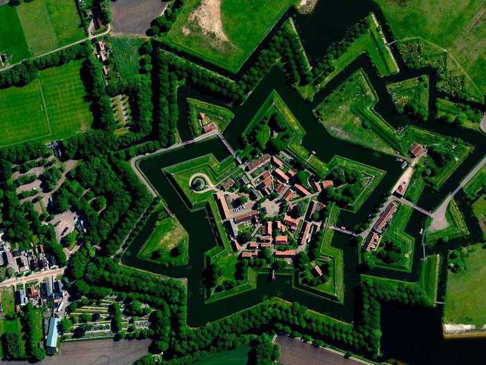 This Dutch "star fort" in Bourtange, Netherlands was built in 1593 during the Eighty Years’ War when William I of Orange wanted to control the only road between Germany and the city of Groningen. Star forts were constructed in the manner you see here so that an attack on any of its five walls could be aggressively counteracted from the two adjacent star points.