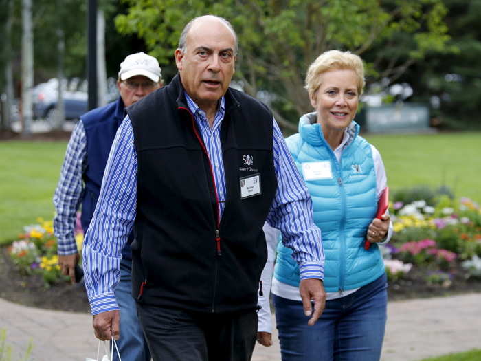 Muhtar Kent, chairman and CEO of Coca-Cola Co., with his wife, Defoe.