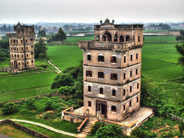 According to UNESCO, the surrounding villages and farmlands of the Kaiping Diaulou, in Guangdong, China, are still part of an active rural economy where village houses, rice fields, bamboo groves, and grazed hills have persisted for what might be over a millennia.