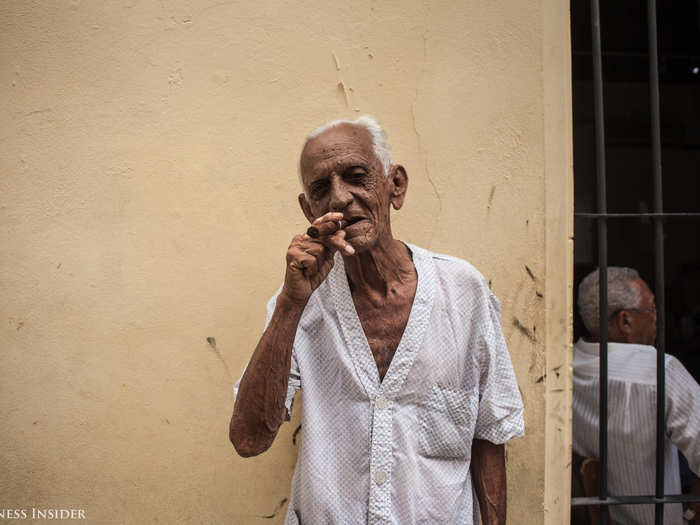 We came across this man smoking a cigar outside of his home. He allowed us to take a photo of him and then asked if we wanted to join his wife