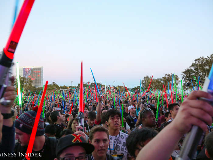 A revved-up audience began waving their lightsabers to the beat.