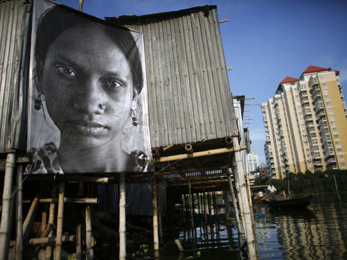 In 2013, JR organized photographs of garment workers around a slum in Dhaka, Bangladesh. The photos were intended to be "a celebration of the hardworking Bengali woman, in support of their struggle for socio-economic justice."