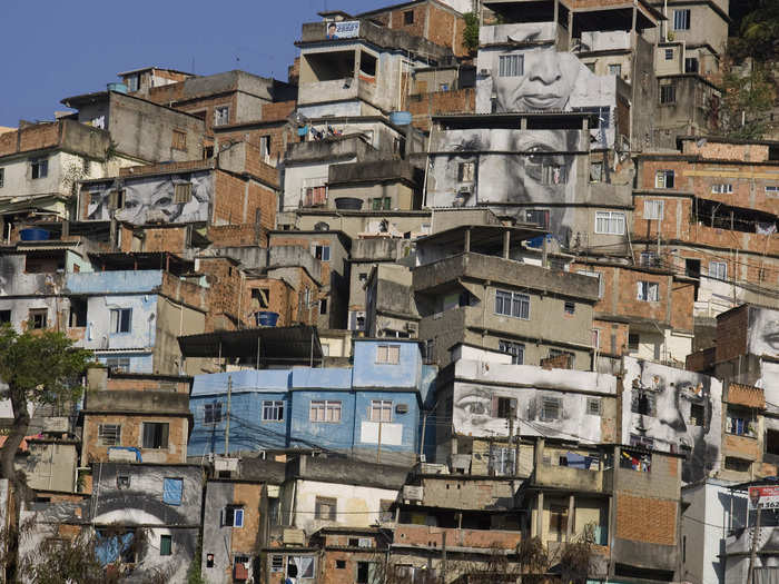 JR covered the walls of homes in favela Providencia in Rio de Janeiro with photographs of women in 2008. The project, called "Women Are Heroes," depicted women whose relatives were the victims of clashes between police and drug traffickers.