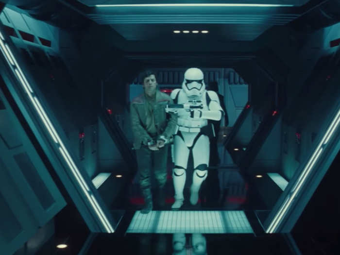 This shot shows one of the new main characters, the X-Wing pilot Poe Dameron, being escorted down a hallway by a stormtrooper. He must be in serious trouble in this scene.