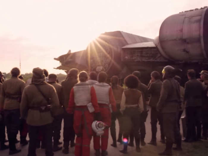 Another shot shows a bunch of the good guys next to the full-sized Millennium Falcon.