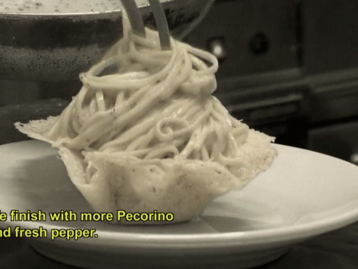 Arrange your cacio e pepe in its cradle and top with more cheese.