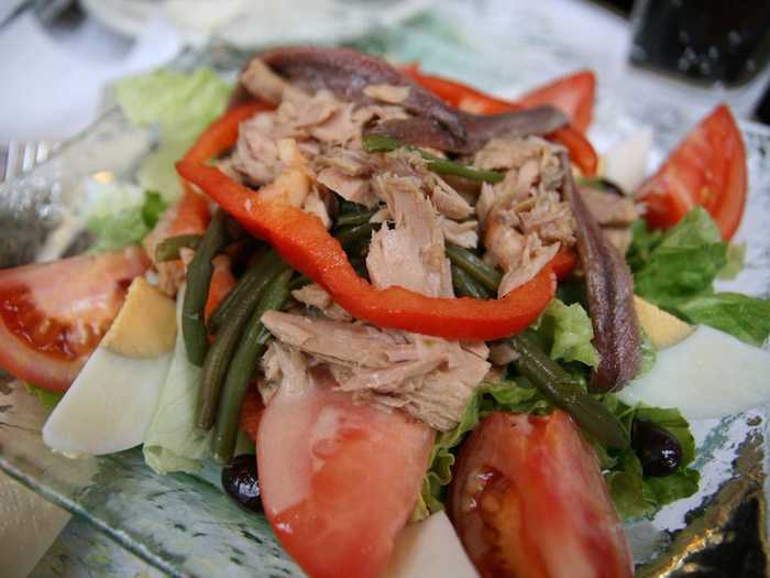 Originally from Nice, the salade nicoise is a combination of lettuce, tomatoes, hard boiled eggs, tuna, anchovies, olives, and green beans.