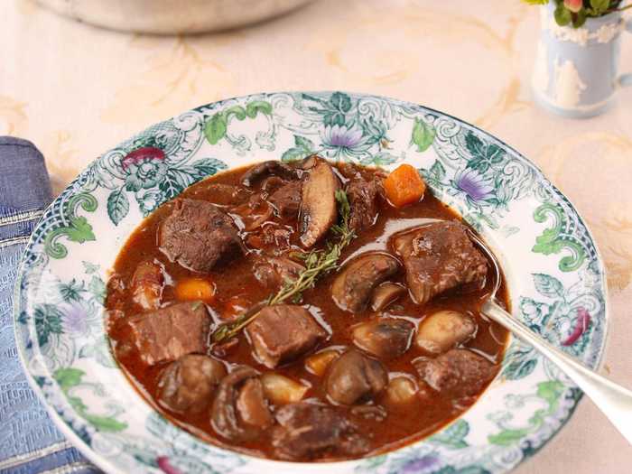 Bœuf Bourguignon is a traditional hearty French stew from the Burgundy region that mixes together beef, vegetables, garlic, and of course, red wine.