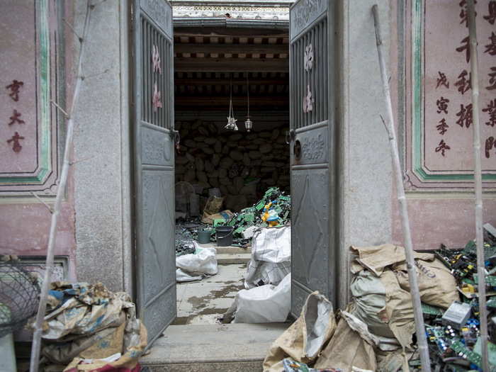 Plastic circuit boards are melted down to salvage bits of valuable metal. Here, circuit boards lie inside a home, waiting to be recycled.