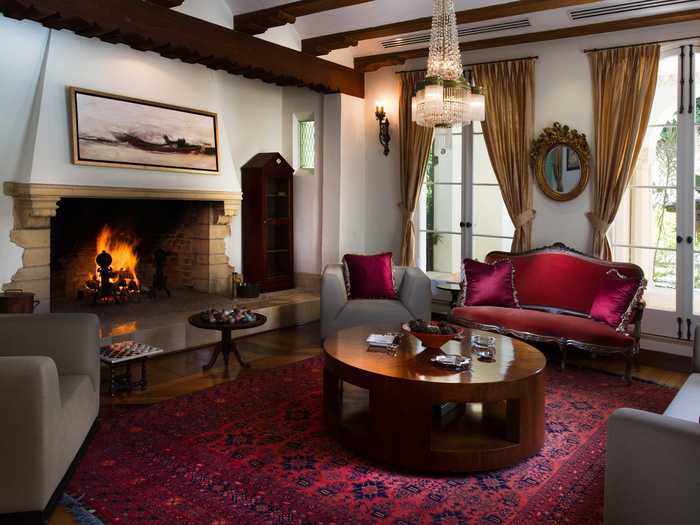 The rooms are cozy with beamed ceilings and fireplaces.