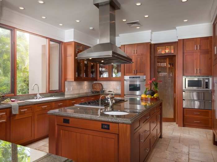 The kitchen features a walk-in pantry and plenty of sunlight.