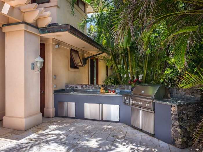 The expansive barbecue area is just off the living room, outside of those sliding pocket doors.