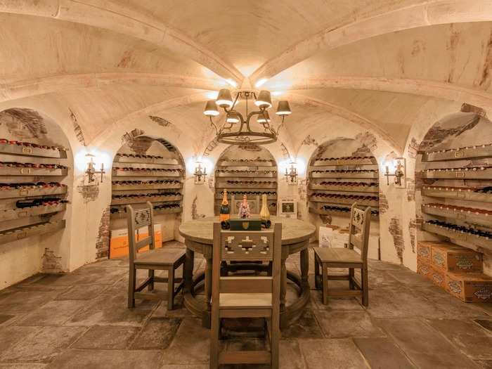 An atmospheric cave-style wine cellar is great for keeping temperatures just right — but also for entertaining guests during a pre-dinner or post-dinner tasting.