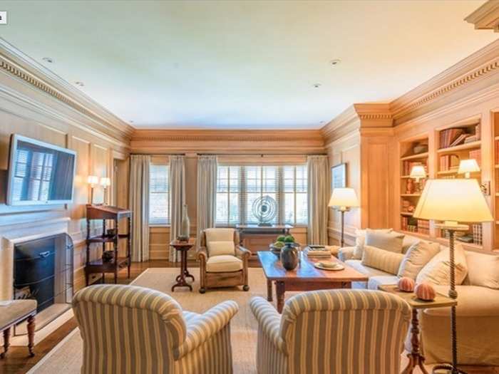 The library for some quiet reading, featuring full wood paneling. The mansion also offers an exercise room, as well as a media and entertainment room in the basement.