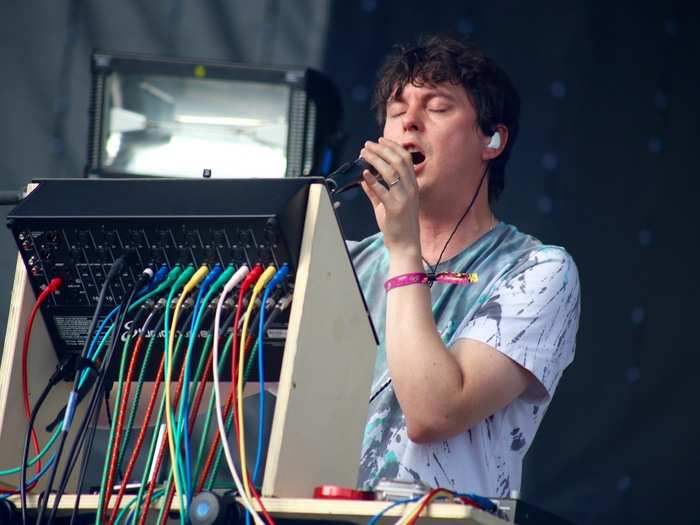 Panda Bear gets down to it — just a man and his insanely complicated computer rig in the hot sun.