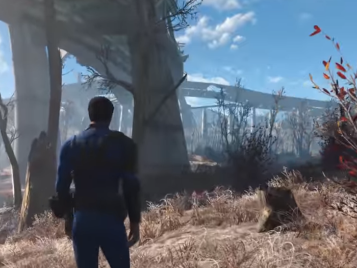 From Concord, the player is shown walking across "The Wasteland," which exists between major cities/settlements in modern "Fallout" games. You can see the remains of the Eisenhower Interstate, a gorgeous blue sky, and the re-emergence of vegetation where human civilization once stood. You can also see the decimation that nuclear war wrought.