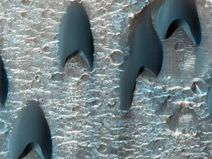 Mawrth Vallis is one of the oldest valleys on Mars and contains a special kind of clay that only forms in the presence of water. Lining the sides of the valley are craters that might have harbored large lakes of liquid water in the past. Shown here are oddly-shaped sand dunes decorating the floor of one of those craters along Mawrth Vallis.