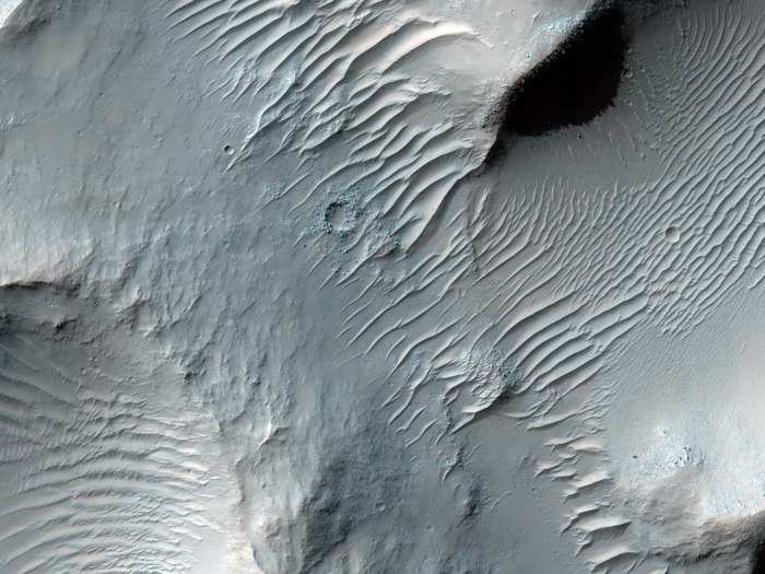 This is one of the only pictures we have from HiRISE of Terra Meridiana, where Watney detoured around the storm. This is one of the longest ancient valleys on Mars, called Samara Vallis. It