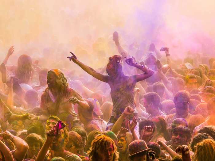 Throw colored paint at a crowd during Holi, a two-day festival in India where you’ll get lost in a sea of bright-colored flours.