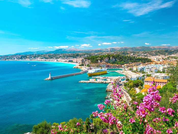 Stroll along the beachfront walkway, the Promenade des Anglais, in Nice, France. The small city on the French Riviera has world-class restaurants, museums, art galleries, and hotels.