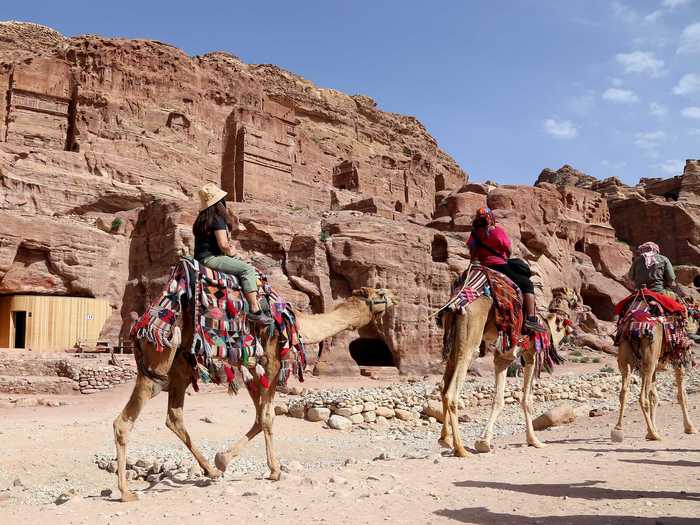 Explore Petra, between the Red and Dead Seas in Jordan. The half-built city is surrounded by mountains, passages, and gorges and is one of the world’s most famous archaeological sites according to UNESCO.