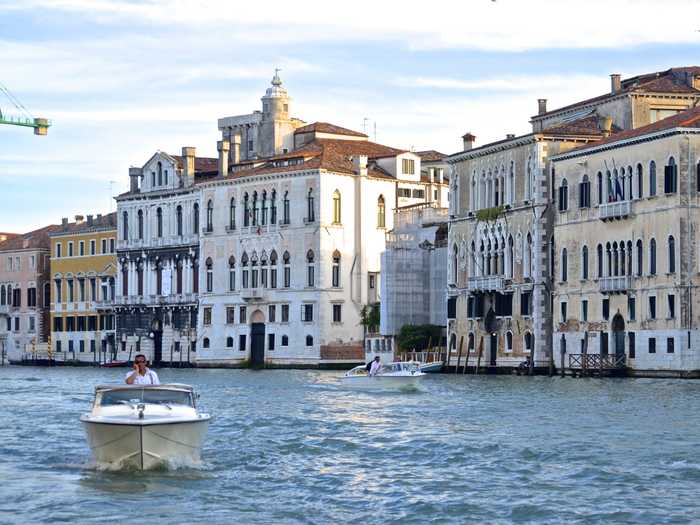 Glide along the canals of Venice, Italy. Hire a private water taxi, which is less touristy than taking a gondola ride.