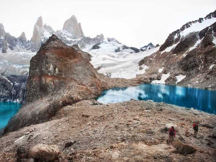 Go hiking in the El Chaltén region of Patagonia, where you’ll see breathtaking panoramas of Mount Fitz Roy and glacial lakes that reflect the stunning landscape.