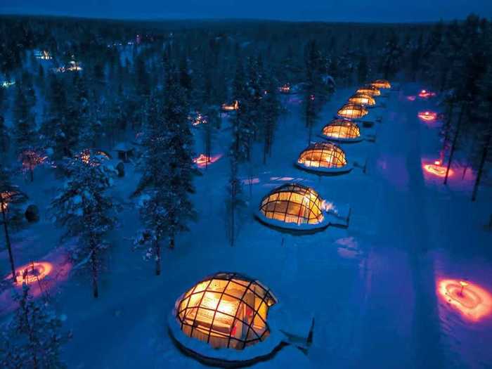 Watch the Northern Lights from your private glass igloo while staying at the Hotel Kakslauttanen, located in Finland’s wilderness.