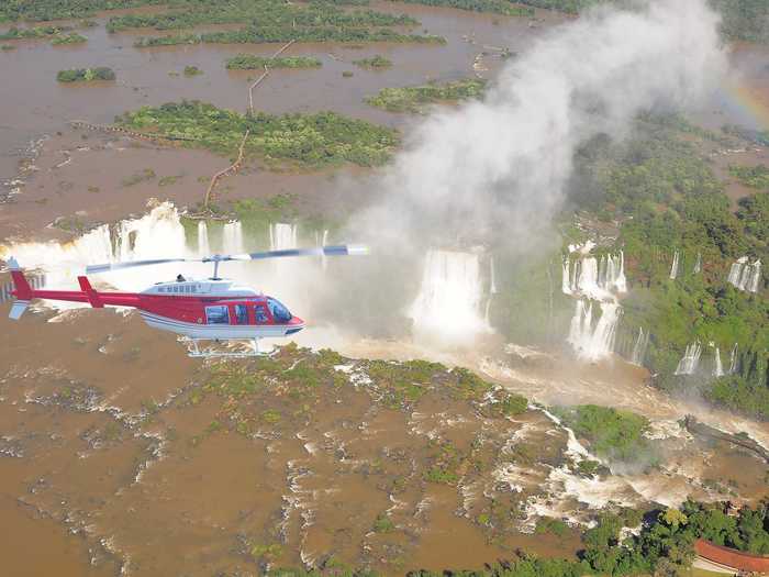 Take a helicopter ride over the majestic Iguazu Falls, which borders Argentina and Brazil and is home to over 200 waterfalls.